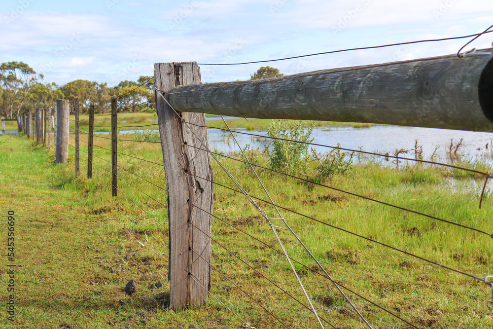 rural wooden fence in field
