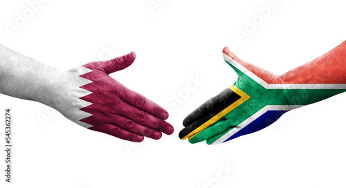 Handshake between South Africa and Qatar flags painted on hands  isolated transparent image.