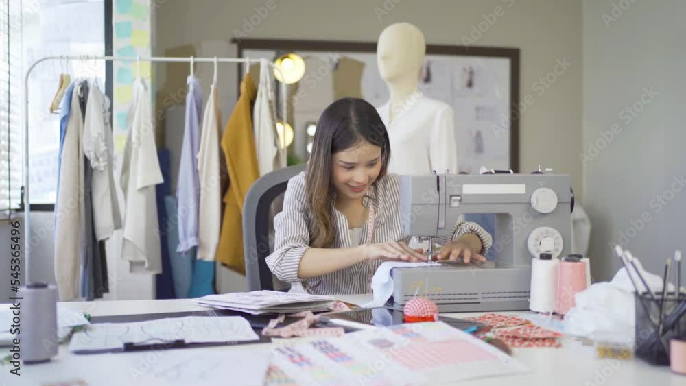 Portrait of freelance designer, tailor, stylist artist Asian woman, Thai person working online on fashion design clothes and costume shirts at home or house. People lifestyle. Creativity business. Portrait of freelance designer, tailor, stylist artist Asian woman, Thai person working online on fashion design clothes and costume shirts at home or house. People lifestyle. Creativity business.