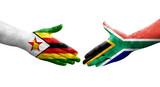 Handshake between South Africa and Zimbabwe flags painted on hands, isolated transparent image.
