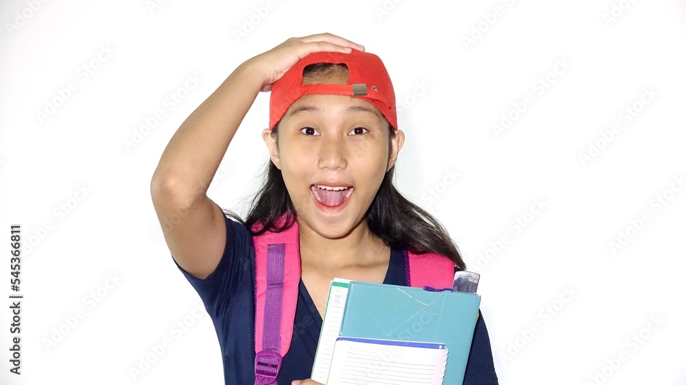 Amazed Asian Female Student Holding Books Isolated Amazed Asian Female Student Holding Books Isolated