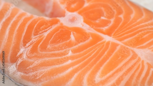 Raw, fresh salmon steak on ice cubes. Buy fish in the market or in the store