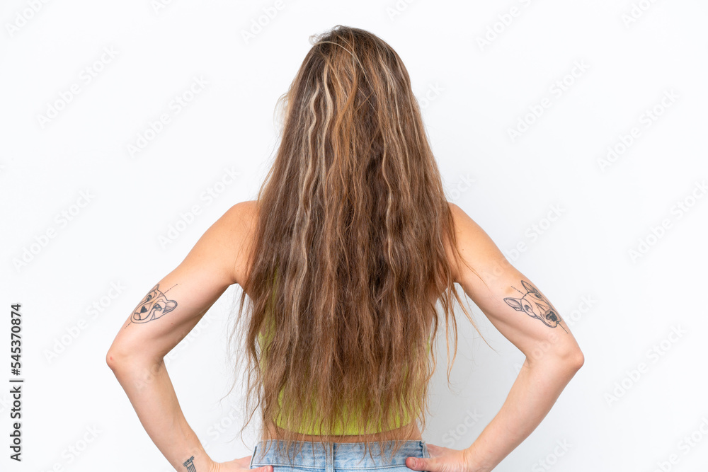 Young caucasian woman isolated on white background in back position Young caucasian woman isolated on white background in back position