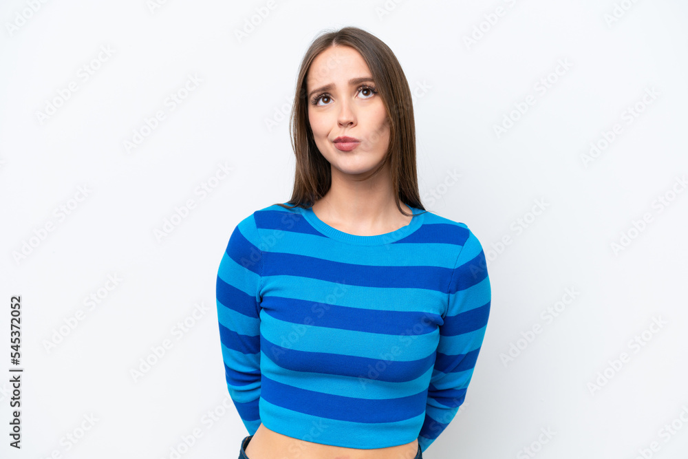 Young pretty caucasian woman isolated on white background and looking up Young pretty caucasian woman isolated on white background and looking up