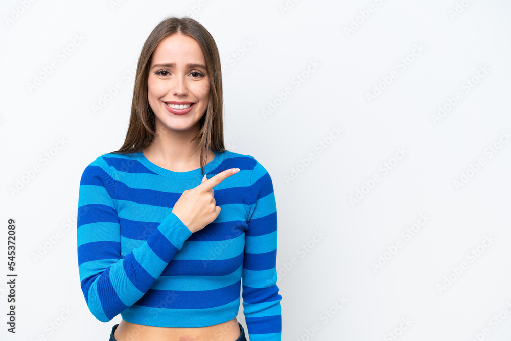 Young pretty caucasian woman isolated on white background pointing to the side to present a product Young pretty caucasian woman isolated on white background pointing to the side to present a product