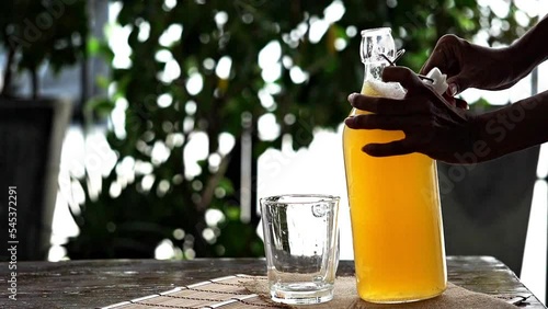 Fermented tea in a glass and bottle, Concept. Kombucha Healthy fermented tea. photo