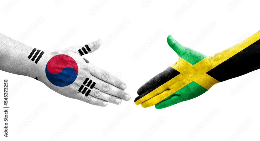 Handshake between South Korea and Jamaica flags painted on hands, isolated transparent image. Handshake between South Korea and Jamaica flags painted on hands, isolated transparent image.