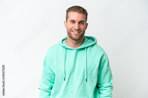 Young handsome caucasian man isolated on white background laughing