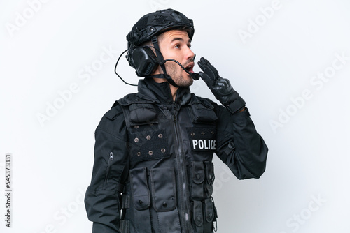 Obraz na płótnie Young caucasian SWAT man isolated on white background yawning and covering wide