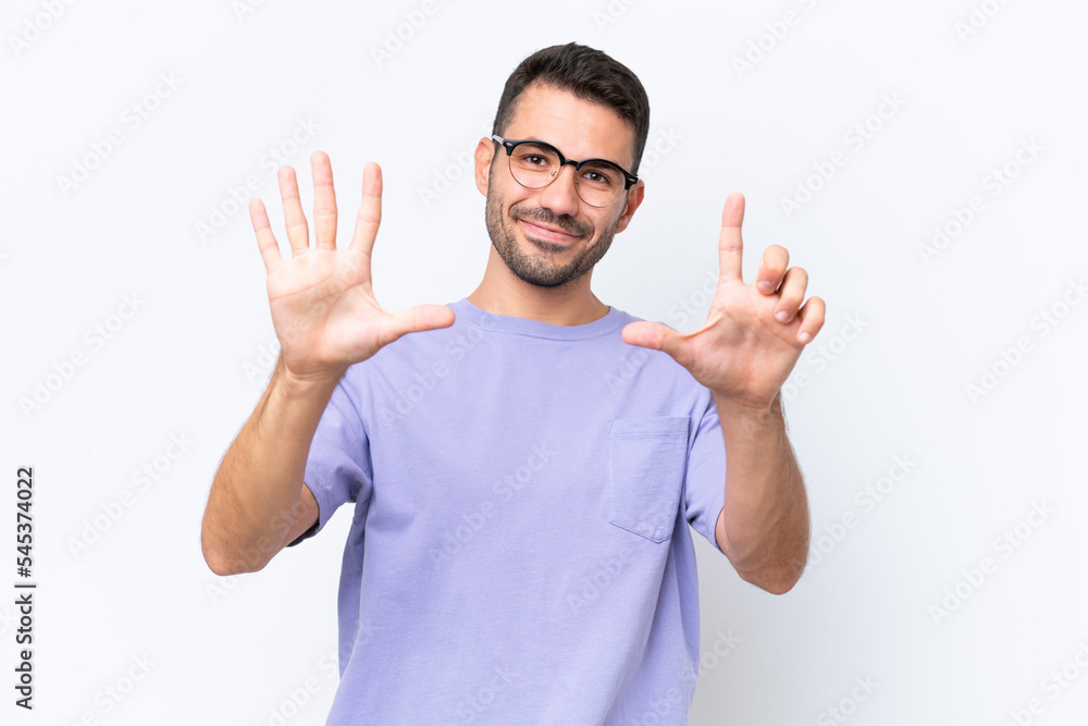 Young caucasian man isolated on white background counting seven with fingers Young caucasian man isolated on white background counting seven with fingers