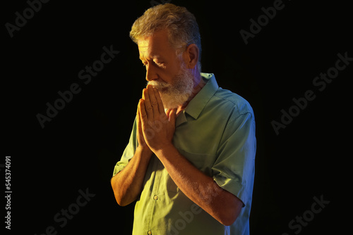 Mature man with lights in c...
