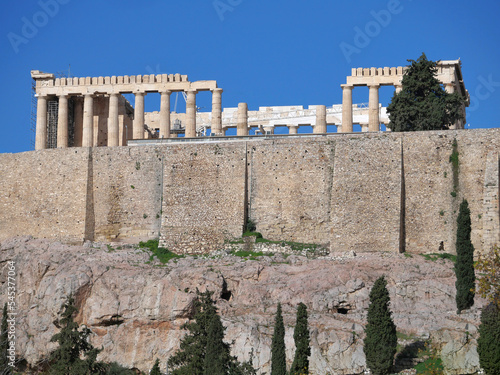 Parthenon ancient greek temple on acropolis of Athens under vibrant blue sky, space for text