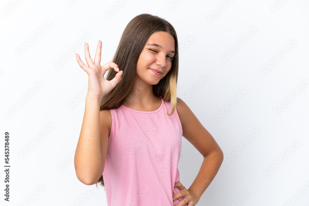 Little caucasian girl isolated on white background showing ok sign with fingers Little caucasian girl isolated on white background showing ok sign with fingers