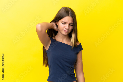Little caucasian girl isolated on yellow background with neckache