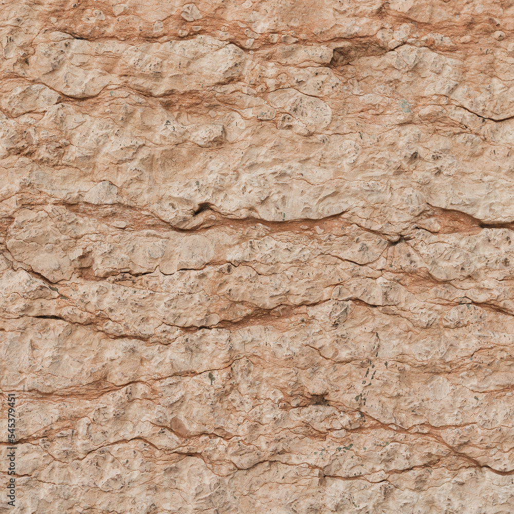 Texture of cracked beige stone rock wall. Old building. Neutral pastel colour background Texture of cracked beige stone rock wall. Old building. Neutral pastel colour background
