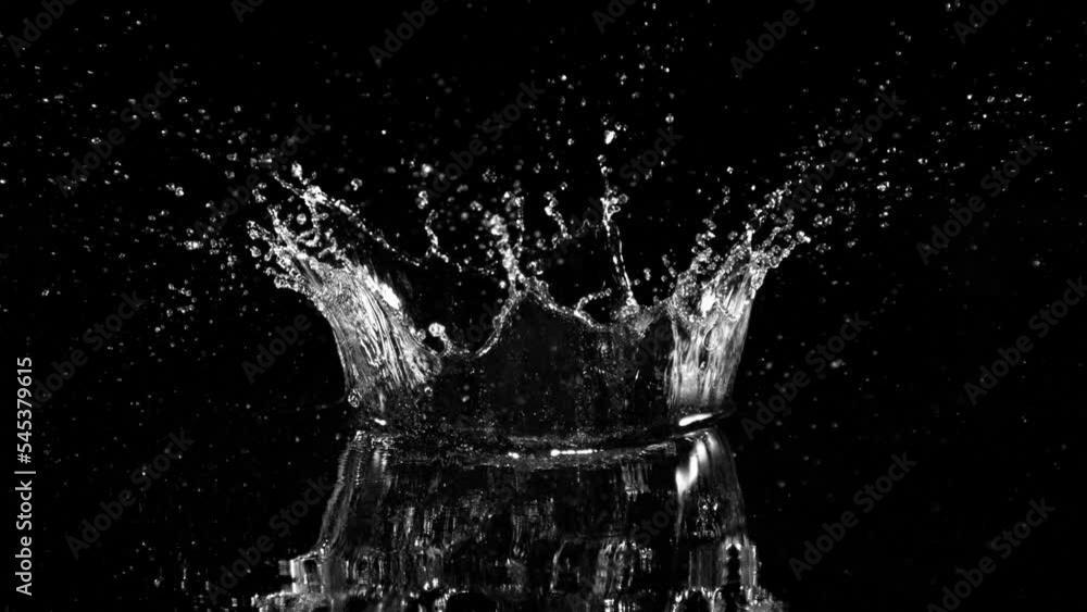 Super slow motion of splashing water crown shape on black background. Filmed on high speed cinema camera, 1000fps. Super slow motion of splashing water crown shape on black background. Filmed on high speed cinema camera, 1000fps.