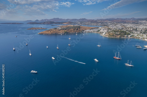 Spectacular view from drone of beautiful yachts filled with Bodrum harbor and ancient citadel in Muğla province of Turkey