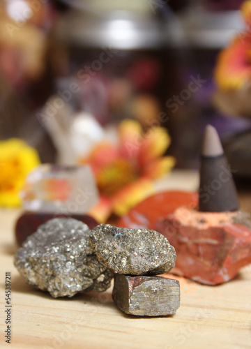 Incense Cone on Stone Slab With Crystals and Flowers