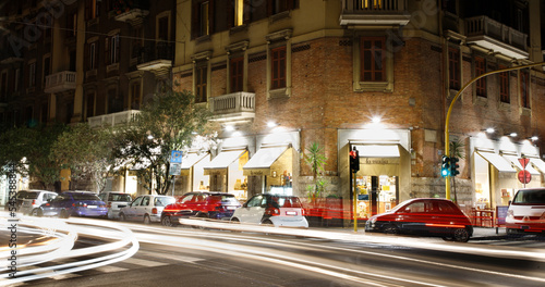 Fototapeta Naklejka Na Ścianę i Meble -  A busy street in Rome, Italy, at night