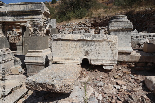 Ancient ruins of Ephesus with greek inscription, carved on marble block at the archaeological site of Ephesus