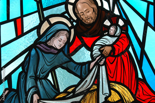 Nativity stained glass displayed indoors.