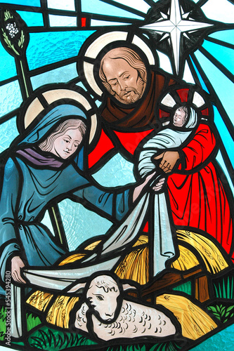 Nativity stained glass displayed indoors.