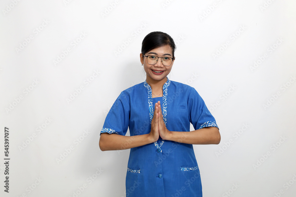 Friendly young asian employee standing with welcoming or greeting hand gesture. Isolated on white background Friendly young asian employee standing with welcoming or greeting hand gesture. Isolated on white background