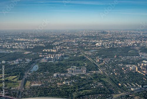 Aerial view photo from airplane of city and clear sky. aerial photo of large city from an airplane window. view of city of Moscow through window from plane © Celt Studio