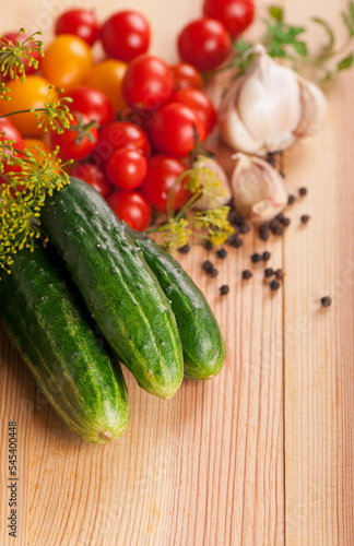 fresh cucumbers, tomatoes of cherry and fennel branch