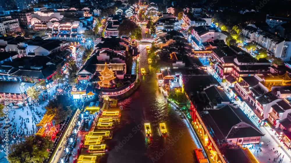 Timelapse aerial photography of night view of shuttle cruise ship on Qinhuai River in Nanjing, Jiangsu, China Timelapse aerial photography of night view of shuttle cruise ship on Qinhuai River in Nanjing, Jiangsu, China