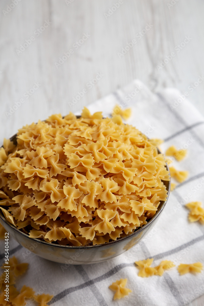 Dry Italian Mini Farfalle Pasta Ready to Cook. Space for text. Dry Italian Mini Farfalle Pasta Ready to Cook. Space for text.
