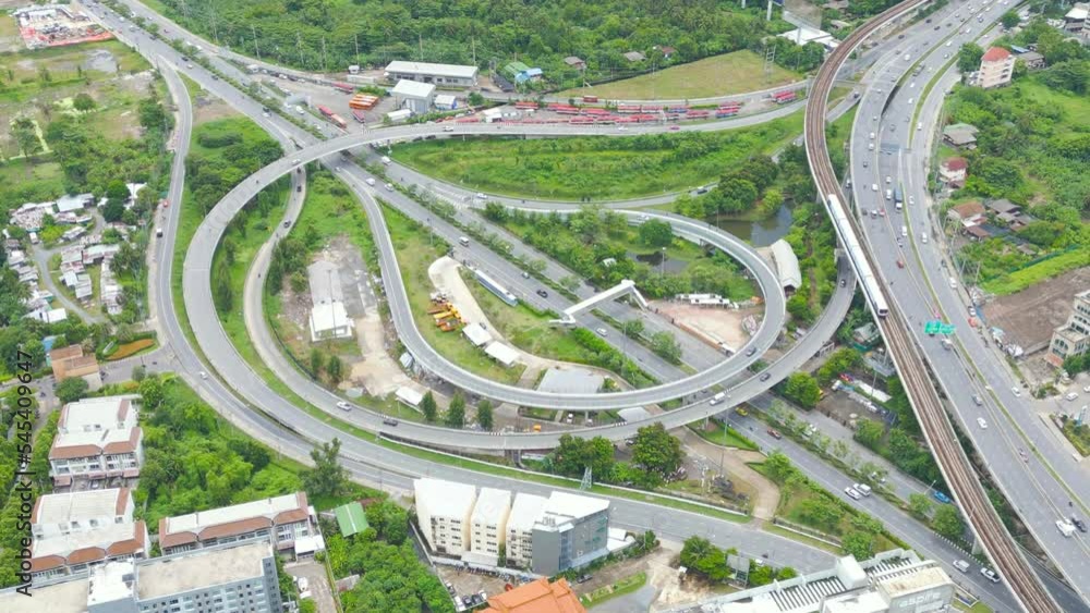 Aerial view of cars driving on highway or moterway. Overpass bridge street roads in connection network of architecture concept. Top view. Urban city, Bangkok, Thailand. Aerial view of cars driving on highway or moterway. Overpass bridge street roads in connection network of architecture concept. Top view. Urban city, Bangkok, Thailand.