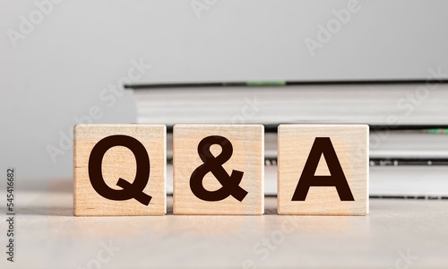 Q and A concept. QnA letters on wood blocks. Questions and answers photo