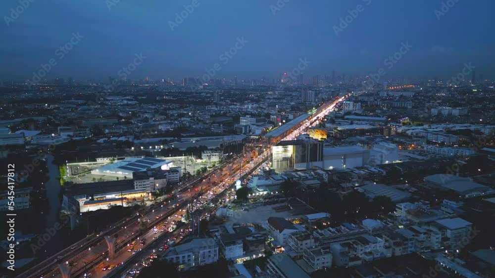 Aerial view of cars driving on highway or moterway. Overpass bridge street roads at night in connection network of architecture concept. Top view. Urban city, Bangkok, Thailand. Aerial view of cars driving on highway or moterway. Overpass bridge street roads at night in connection network of architecture concept. Top view. Urban city, Bangkok, Thailand.