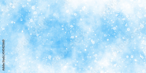 Abstract cloudy blue background with snowflakes, beautiful blue watercolor background with glitter particles, light blue bokeh background for wallpaper, invitation, cover and design. © DAIYAN MD TALHA