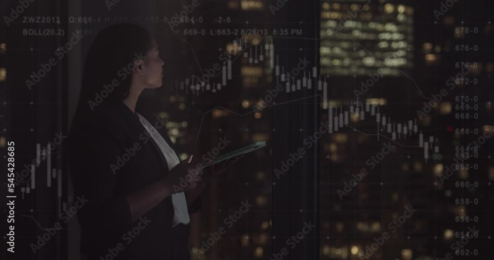 Business Woman using Digital Tablet in Office, Looking at Stock Market Data Business Woman using Digital Tablet in Office, Looking at Stock Market Data