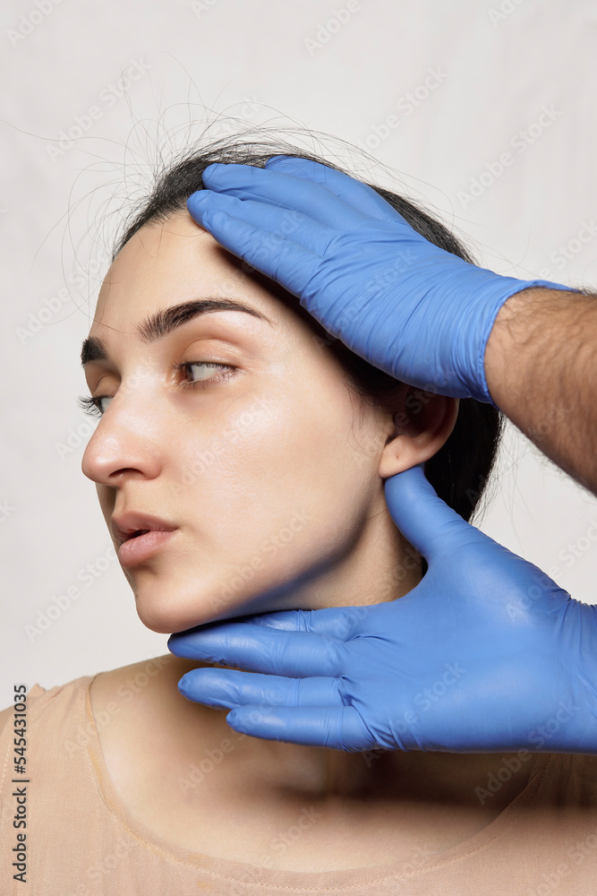 a woman getting her eyebrows done by a professional hairdressery at the beauty salon in paris, france a woman getting her eyebrows done by a professional hairdressery at the beauty salon in paris, france