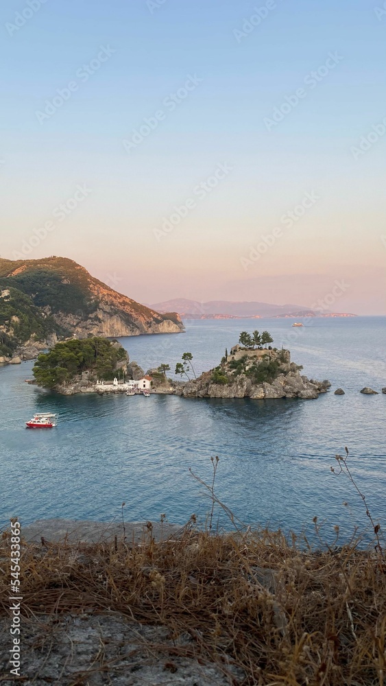 Scenic view of rocky islands in Parga, Greece during sunset