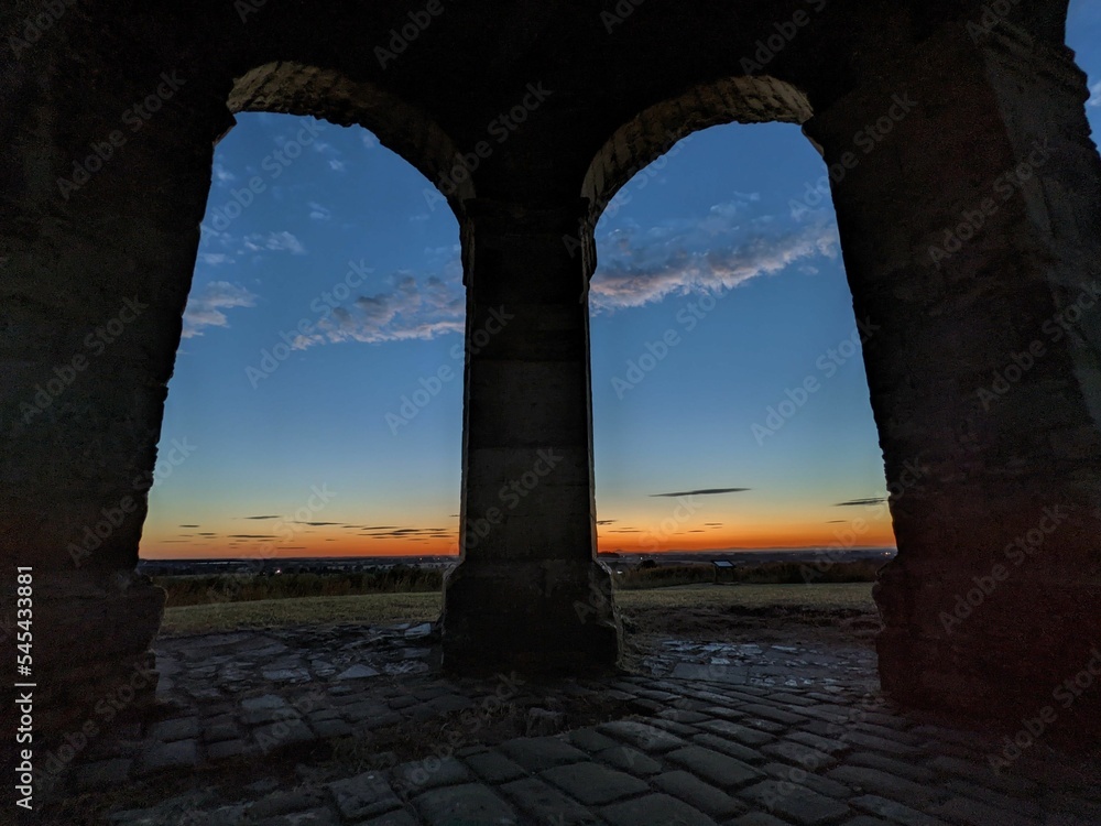 Sunset sky captured from the arches of an old building