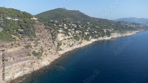 Aerial view of an island with green and overlooking blue ocean