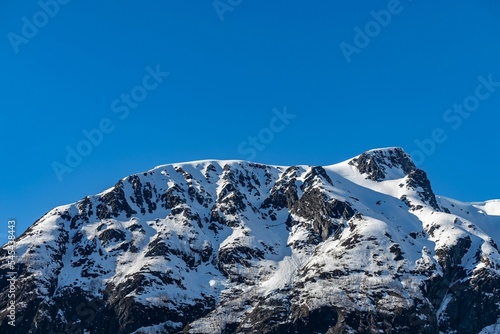 Winter mountains covered in snow against the blue sky in Tresfjorden, Vestnes, Orskogfjellet photo