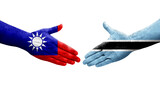 Handshake between Taiwan and Botswana flags painted on hands, isolated transparent image.