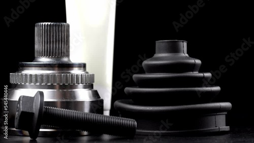 Car CV joint. Drive shaft connection on black background. New constant velocity joints. New automotive CV joints. Quality spare parts for car service or maintenance. Auto parts store. kit with anther