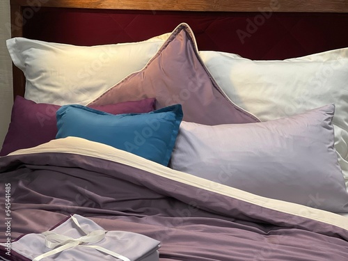 Tableau sur toile Comfortable bed with pillows, blanket, linen in bedroom.