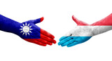 Handshake between Taiwan and Luxembourg flags painted on hands, isolated transparent image.