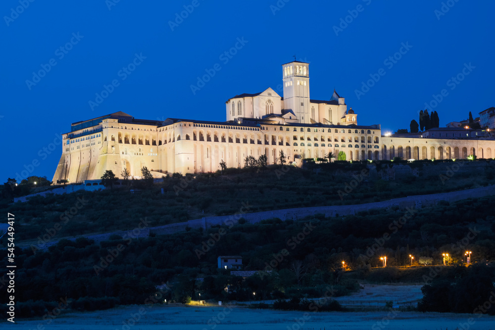 Assisi Basilica by night,  Umbria region, Italy. The town is famous for the most important Italian Basilica dedicated to St. Francis - San Francesco.