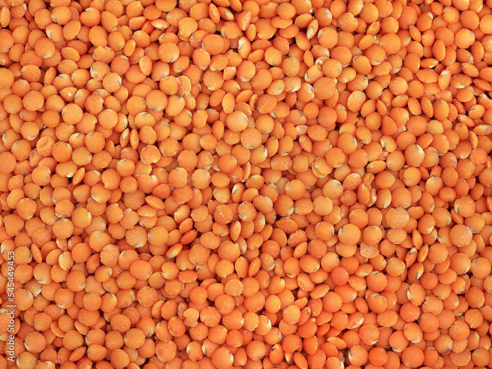top view of red lentils texture, background of healthy vegan food with high protein top view of red lentils texture, background of healthy vegan food with high protein