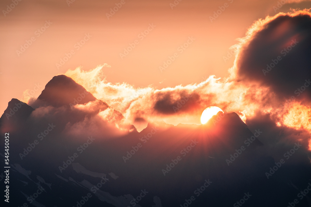 Φωτογραφία The sun is descending behind the peaks of the Orobie Alps, Northern Italy,