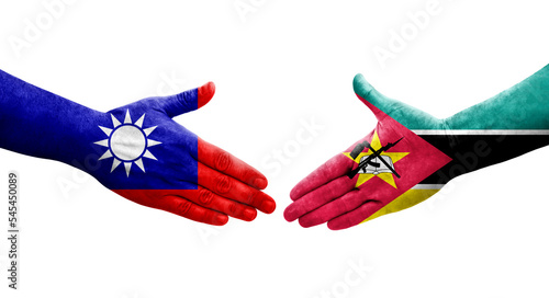 Handshake between Taiwan and Mozambique flags painted on hands, isolated transparent image.