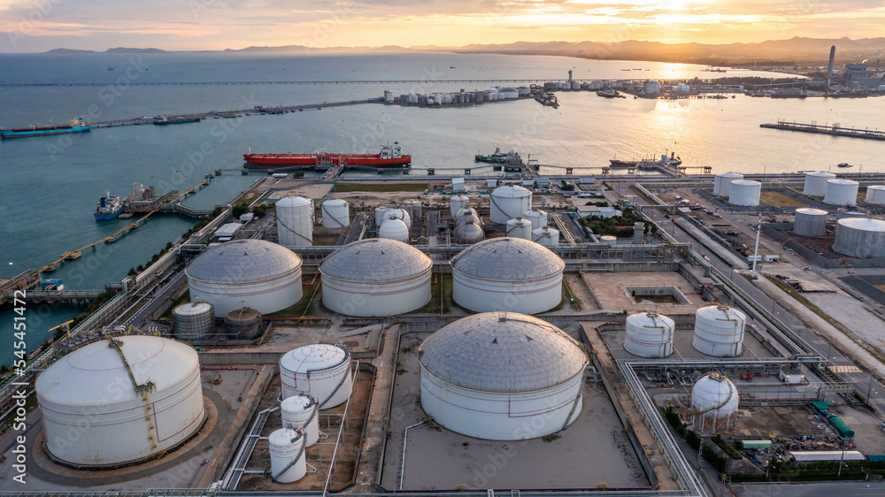 Aerial view oil terminal industrial facility storage tank oil and petrochemical product for transport to further storage facility, Storage tank petroleum petrochemical refinery product at oil terminal - obrazy, fototapety, plakaty 